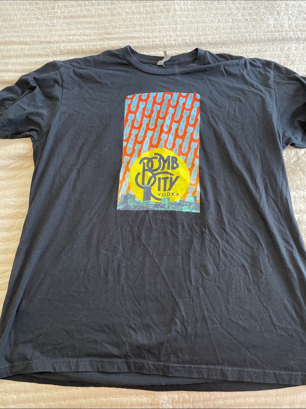 Next Level Apparel Black Tee with Yellow & Red Graphic